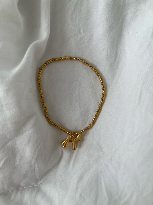 gold balloon dog bracelet